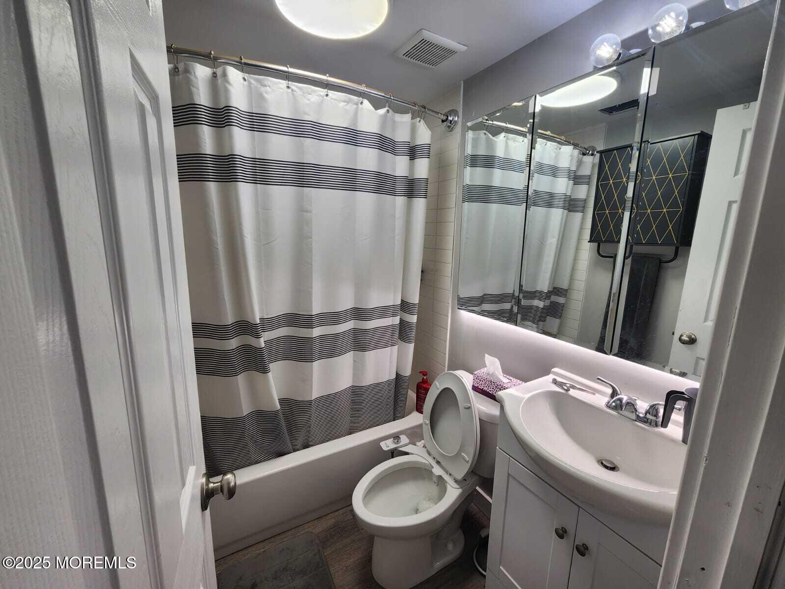 215 Miller Road Lakewood, NJ 08701 - Photo 6 of 12 a bathroom with a sink toilet and shower