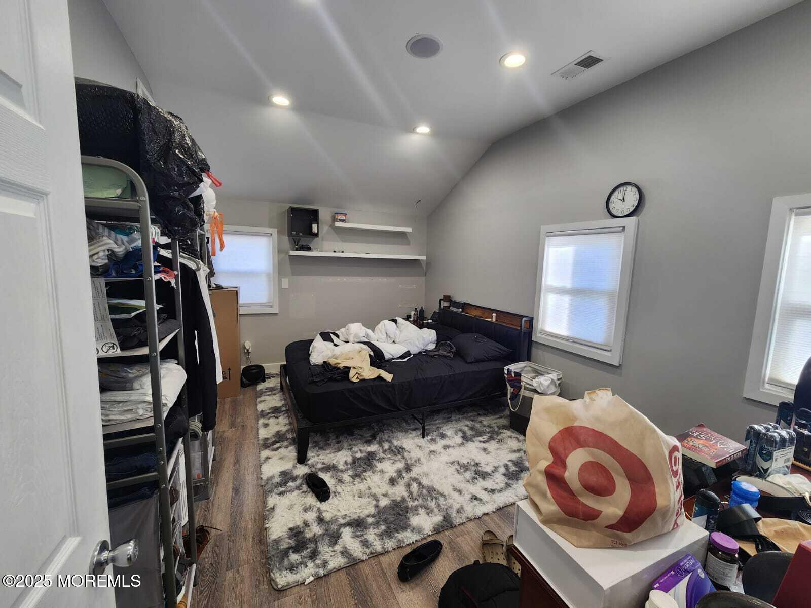 215 Miller Road Lakewood, NJ 08701 - Photo 7 of 12 a living room with lots of furniture and a rug