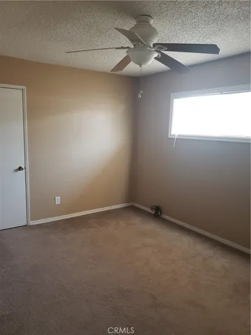 a utility room with cabinets washer and dryer
