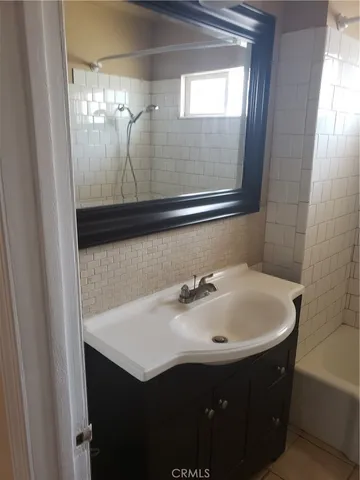 a view of a big yard with a house in the background