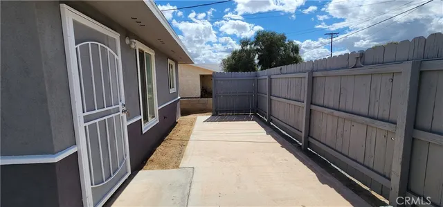 a view of balcony with wooden floor and large window