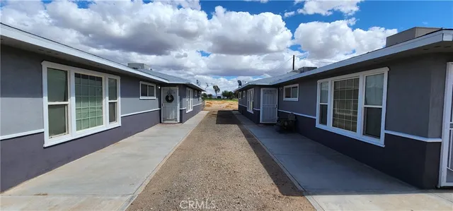 a view of a porch with wooden floor and stairs