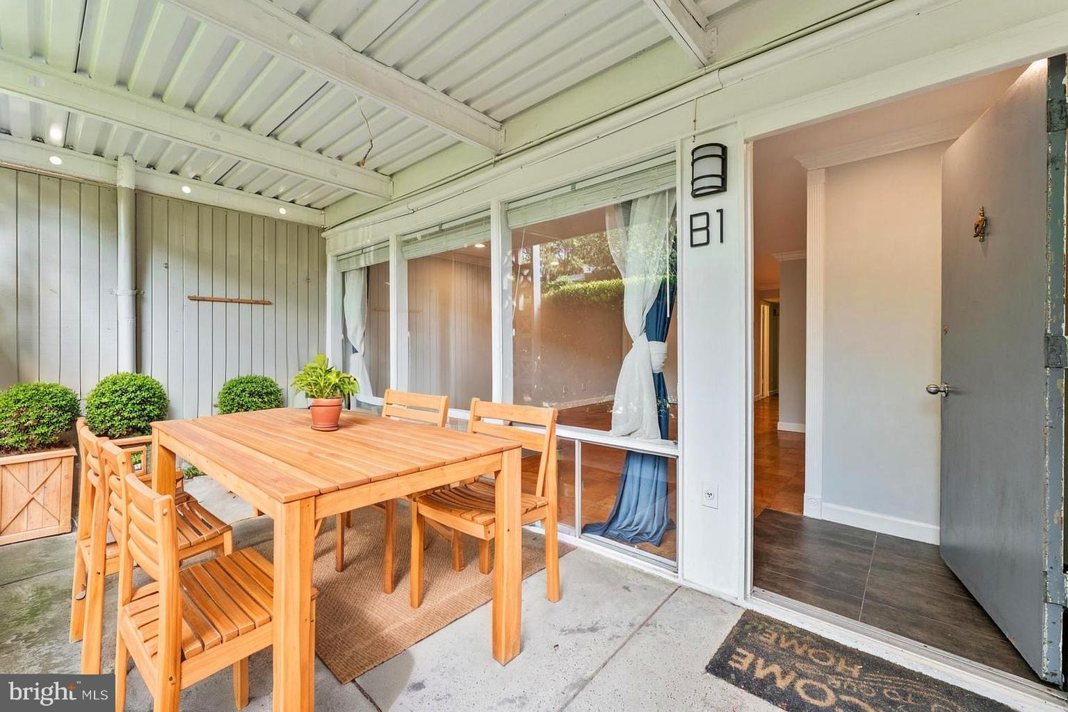 7541 Spring Lake Drive, Unit B1 Bethesda, MD 20817 - Photo 2 of 35 a dining room with a table and chairs