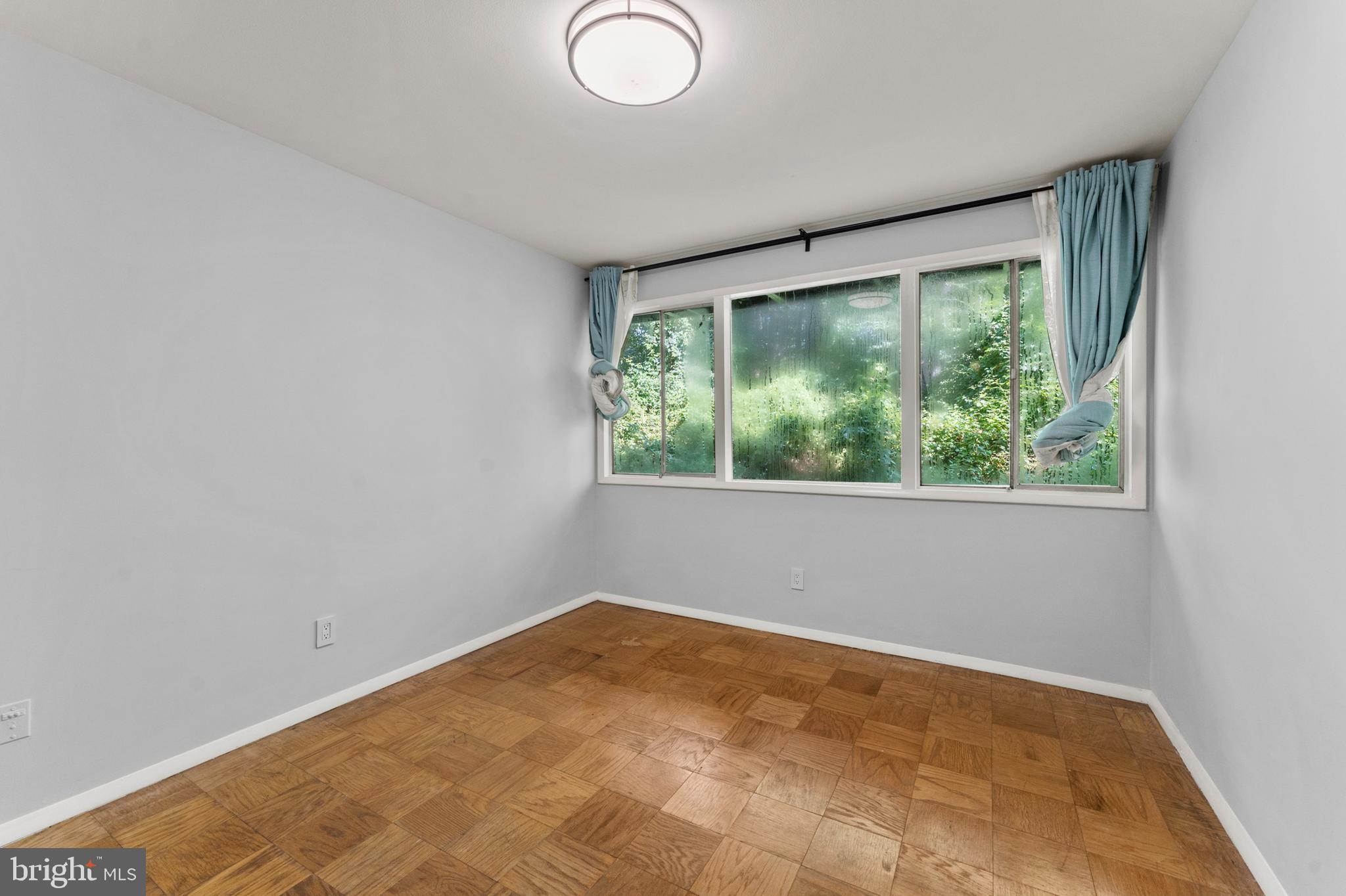 7541 Spring Lake Drive, Unit B1 Bethesda, MD 20817 - Photo 10 of 35 an empty room with a window