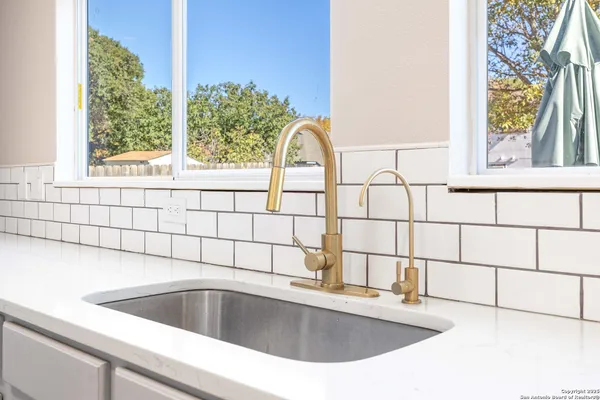 a close view of sink and mirror