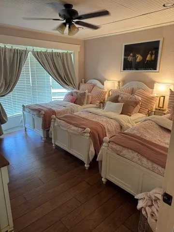 a bed room with a bed and a chair