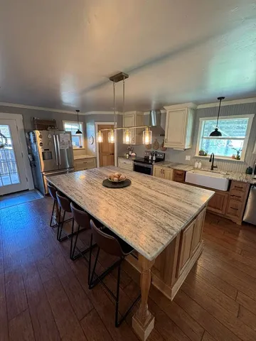 a dining table with chairs and wooden floor