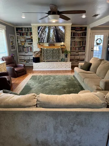 a living room with furniture and a fireplace