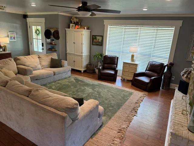 a living room with furniture and a window