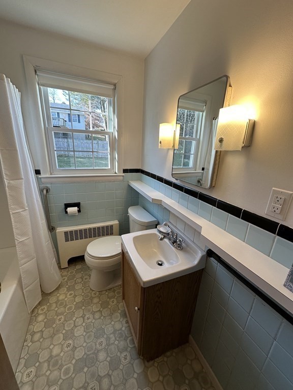 51 Prudential Road Worcester, MA 01606 - Photo 12 of 26 a bathroom with a sink a toilet and mirror