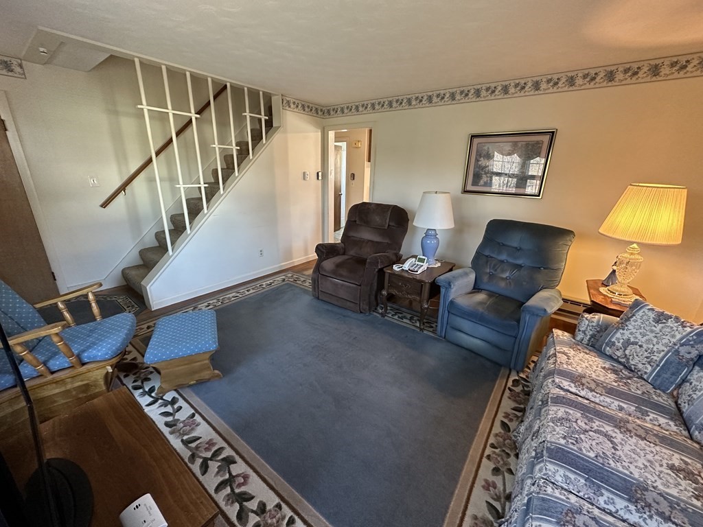 51 Prudential Road Worcester, MA 01606 - Photo 7 of 26 a living room with furniture and a piano