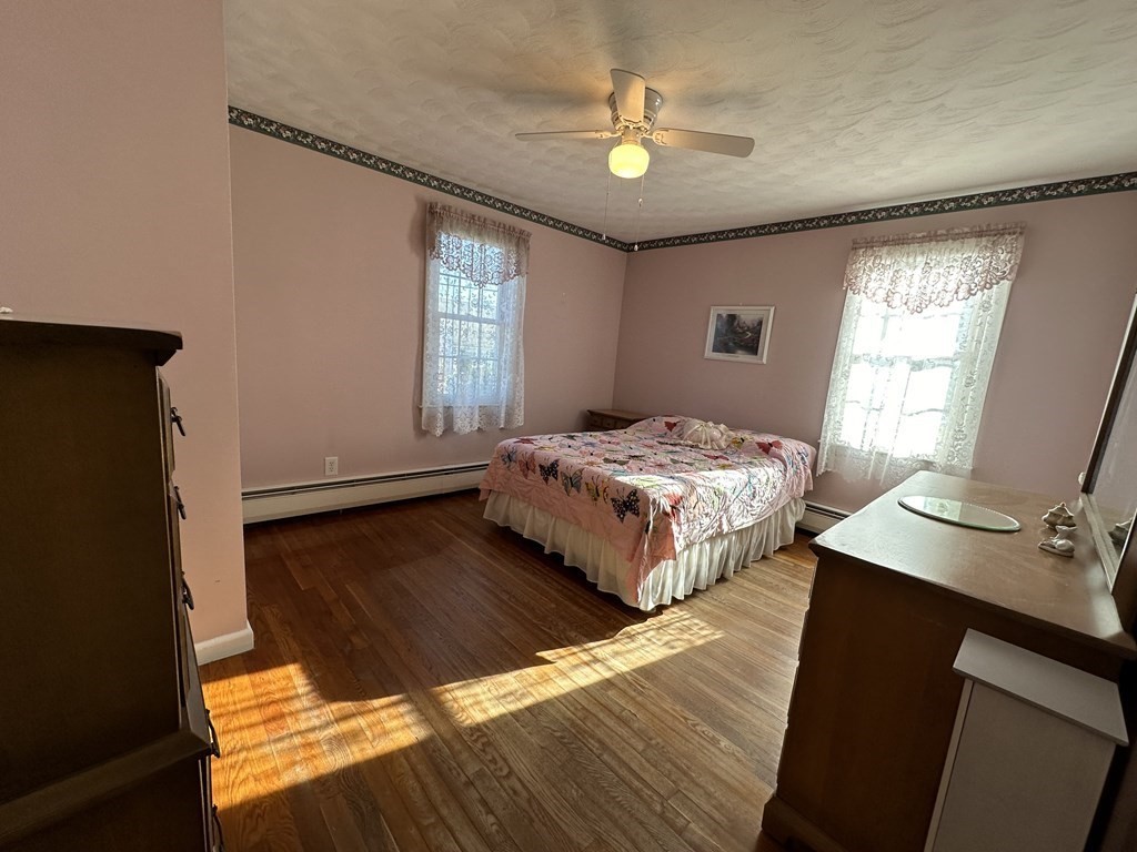 51 Prudential Road Worcester, MA 01606 - Photo 9 of 26 a bedroom with a bed and a chandelier