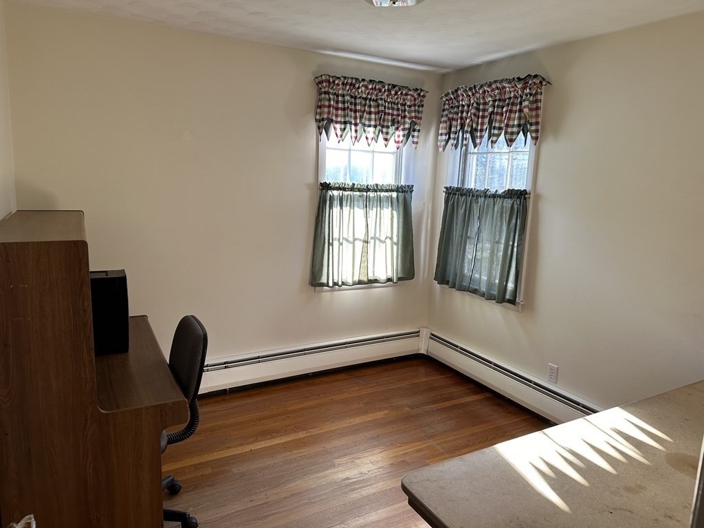 51 Prudential Road Worcester, MA 01606 - Photo 10 of 26 a view of an empty room with wooden floor and a window