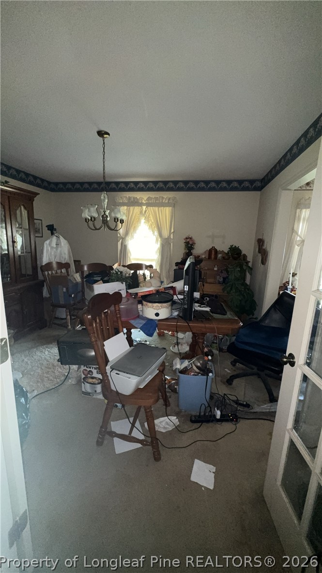 7939 Clinton Road Stedman, NC 28391 - Photo 11 of 50 a room with lots of chairs and a projector screen