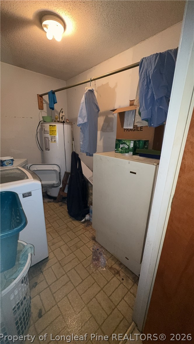 7939 Clinton Road Stedman, NC 28391 - Photo 18 of 50 a utility room with dryer and washer