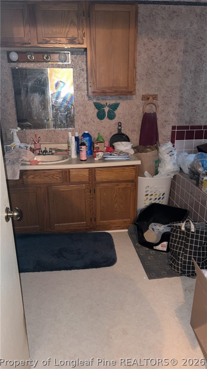 7939 Clinton Road Stedman, NC 28391 - Photo 26 of 50 a kitchen with a stove and a refrigerator