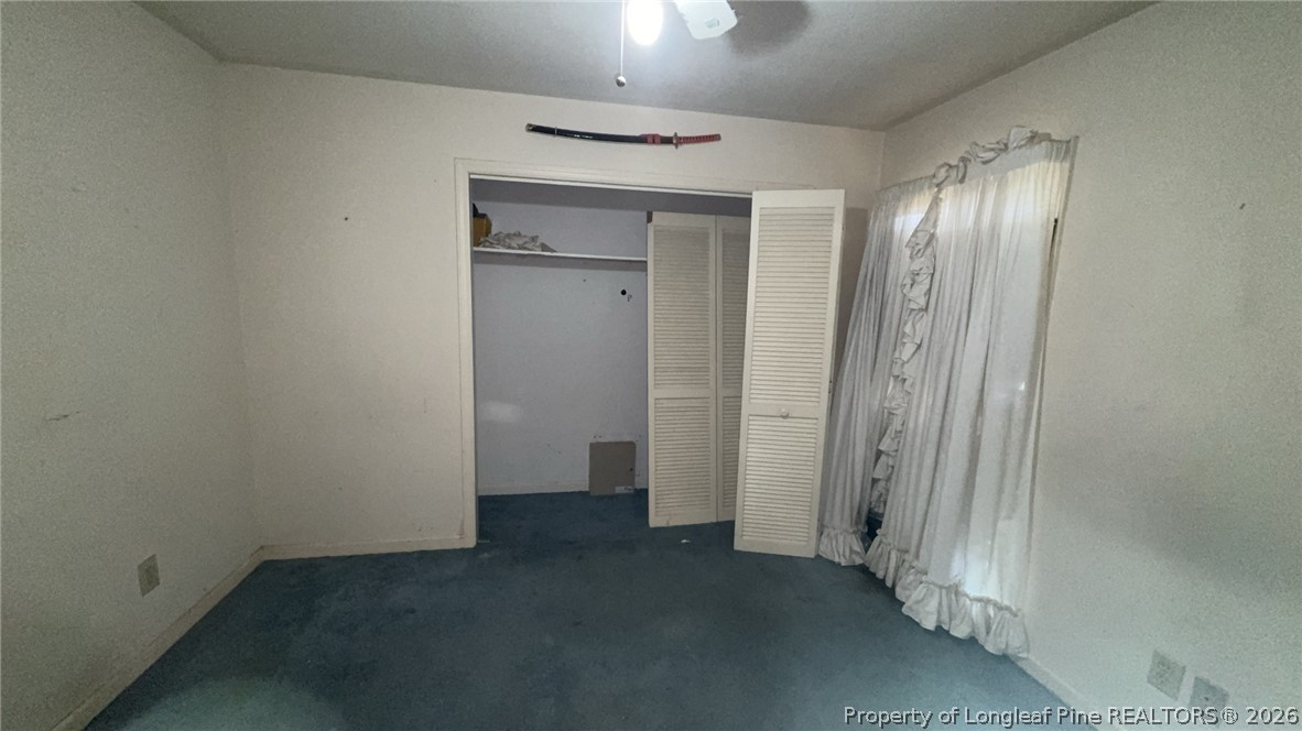 7939 Clinton Road Stedman, NC 28391 - Photo 40 of 50 an empty room with closet and wooden floor