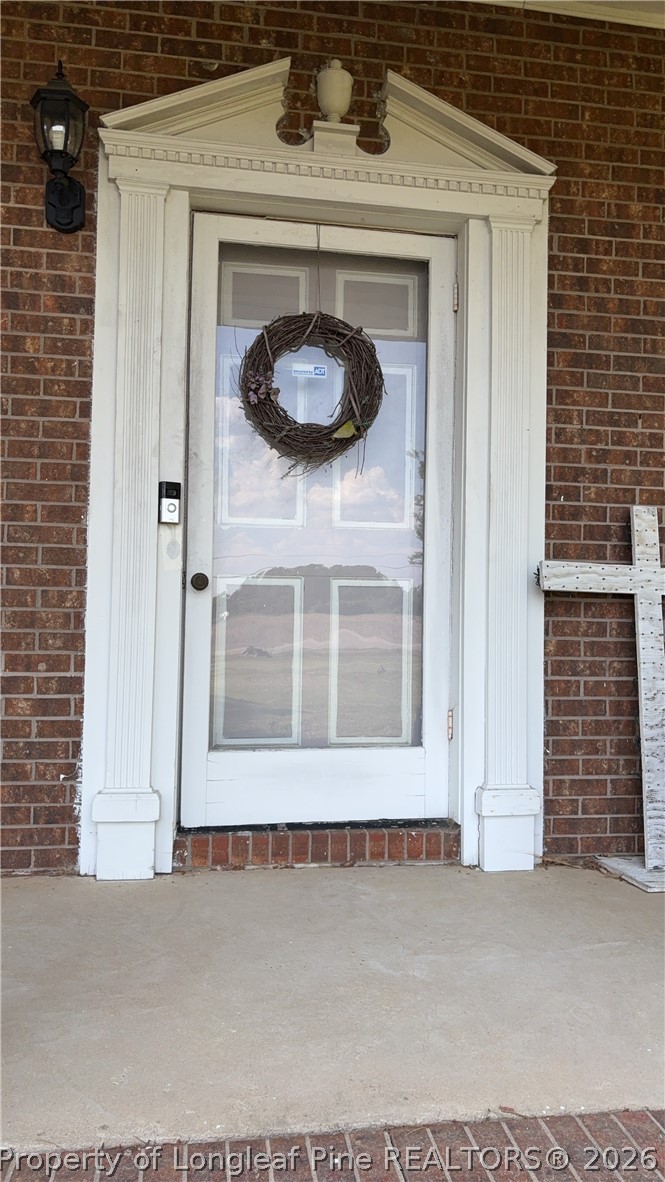 7939 Clinton Road Stedman, NC 28391 - Photo 8 of 50 a view of a door of a house