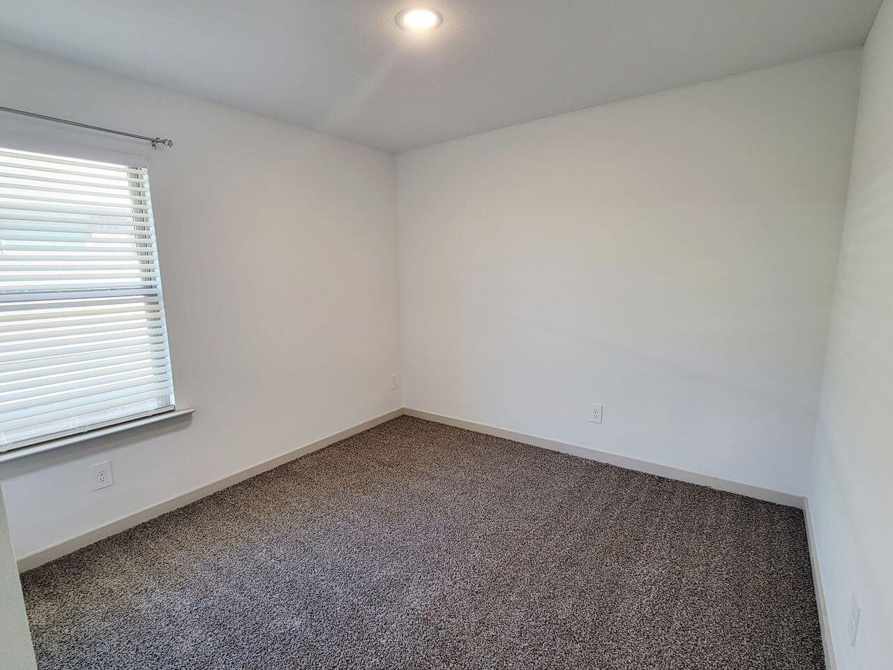 7324 9th Street Lubbock, TX 79416 - Photo 11 of 21 an empty room with a window