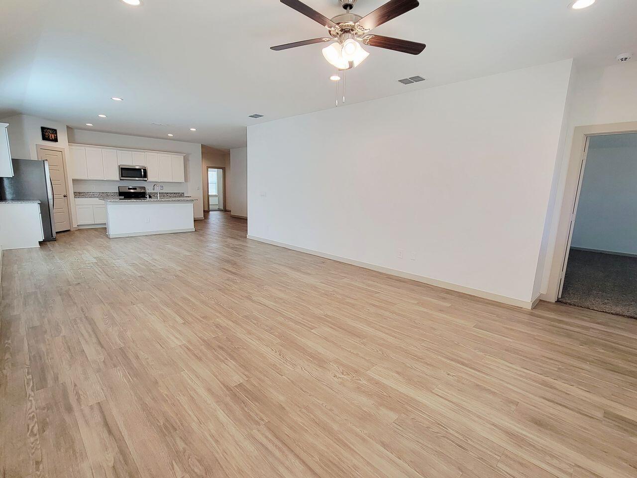 7324 9th Street Lubbock, TX 79416 - Photo 6 of 21 a view of a kitchen with a sink and a refrigerator