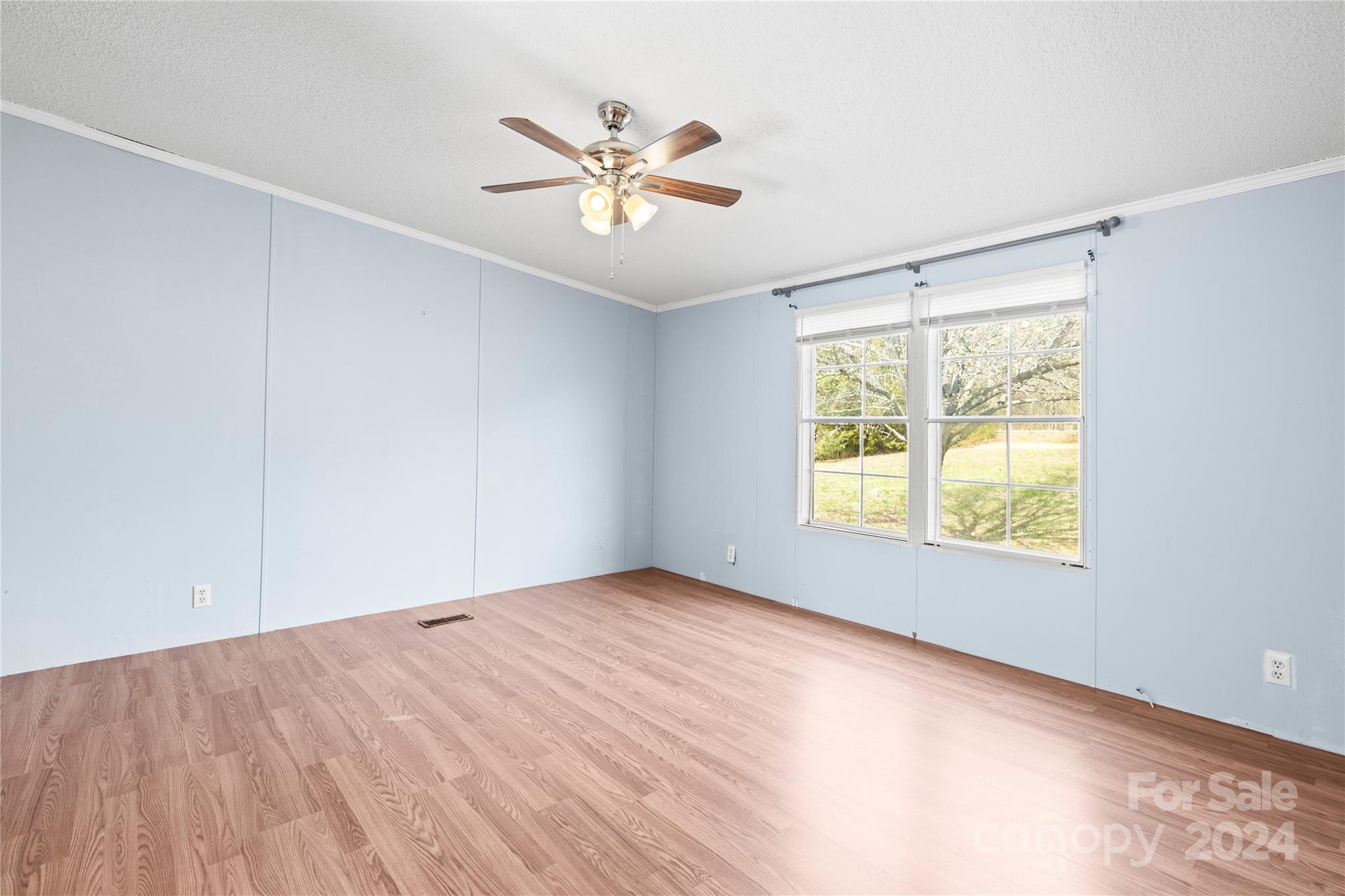 436 Beth Haven Church Road Denver, NC 28037 - Photo 11 of 32 a view of an empty room with wooden floor and a window