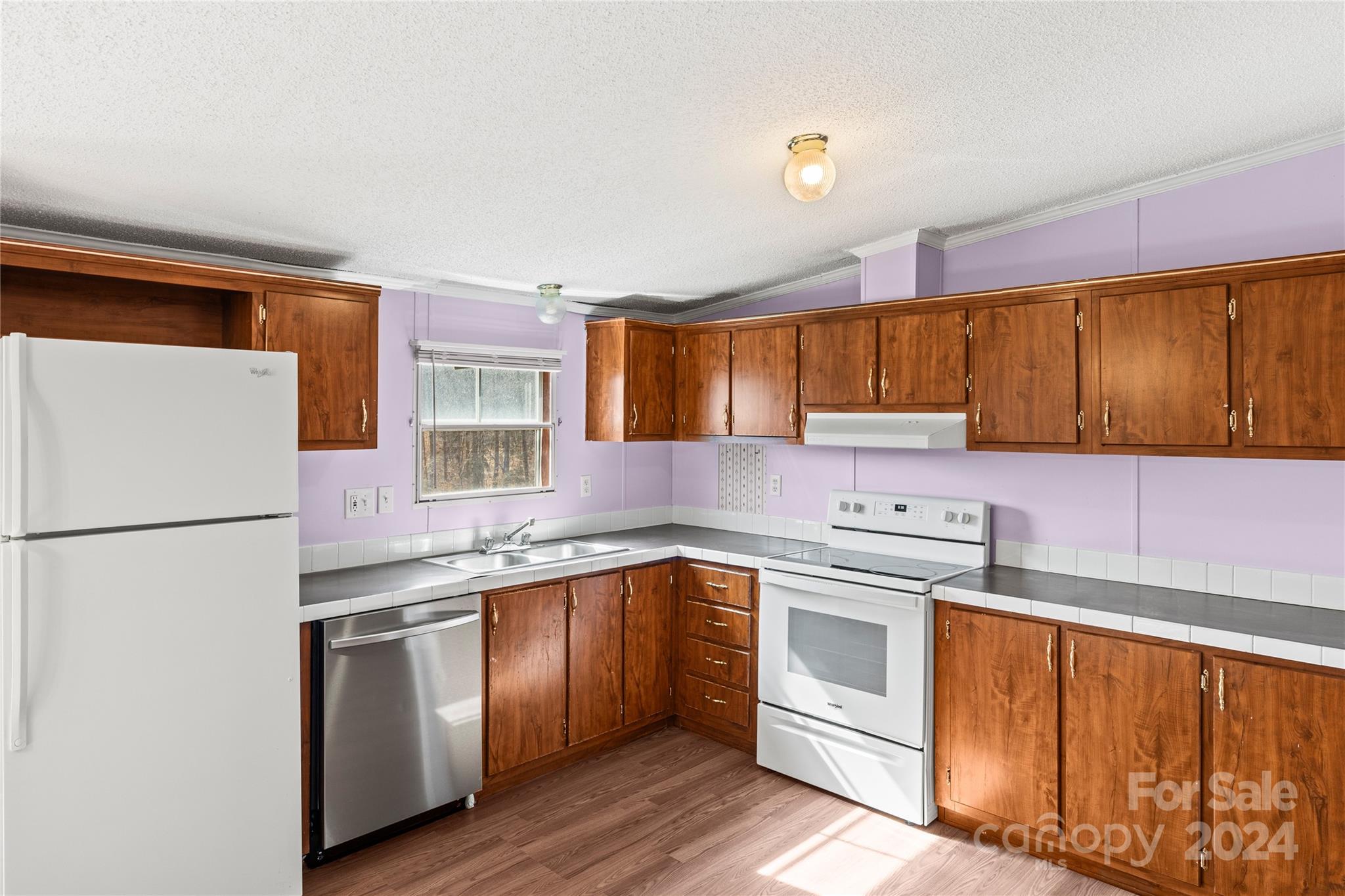 436 Beth Haven Church Road Denver, NC 28037 - Photo 5 of 32 a kitchen with a white cabinets and white appliances