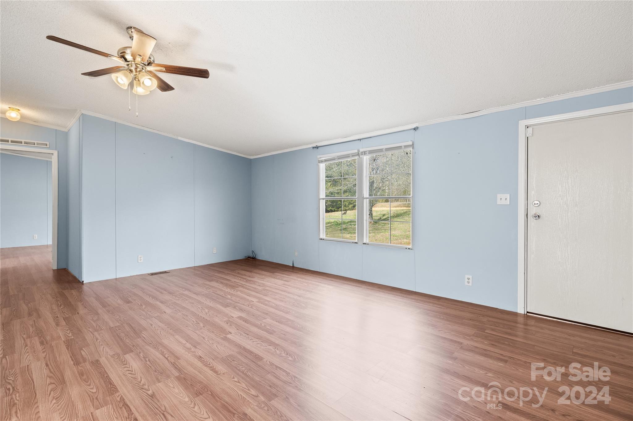 436 Beth Haven Church Road Denver, NC 28037 - Photo 7 of 32 an empty room with wooden floor and windows