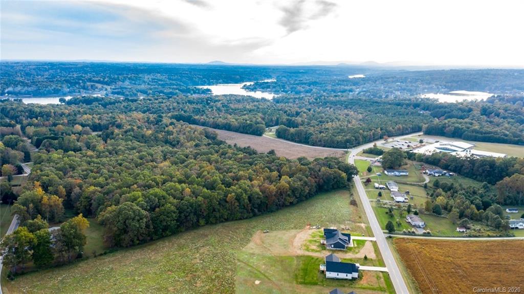 7241 Church Road Taylorsville, NC 28681 - Photo 15 of 27 an aerial view of lake and residential houses with outdoor space