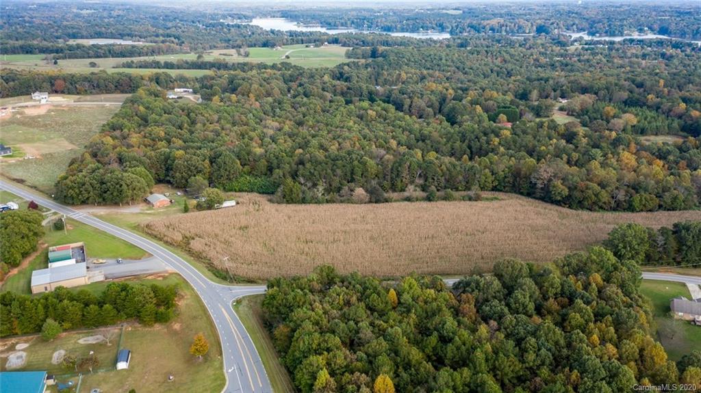 7241 Church Road Taylorsville, NC 28681 - Photo 3 of 27 an aerial view of a house with a yard and lake view