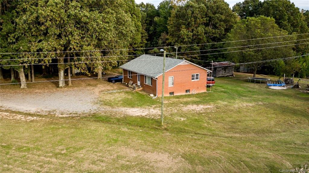 7241 Church Road Taylorsville, NC 28681 - Photo 24 of 27 a swimming pool with some trees in the background