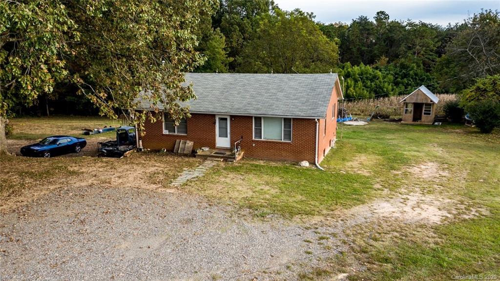 7241 Church Road Taylorsville, NC 28681 - Photo 26 of 27 a view of a house with backyard and a tree