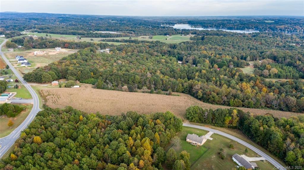 7241 Church Road Taylorsville, NC 28681 - Photo 4 of 27 a view of a lake with a yard