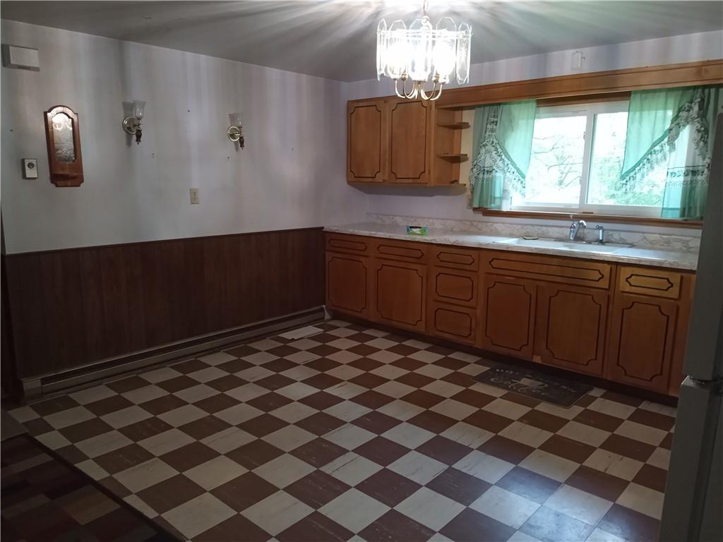3292 Georgetown Road Polk, PA 16342 - Photo 14 of 24 a room with a black white checkered floor and a large window