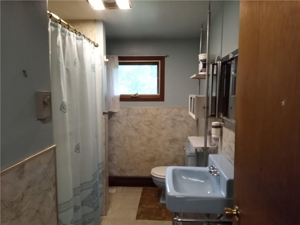 3292 Georgetown Road Polk, PA 16342 - Photo 17 of 24 a bathroom with a sink and a toilet