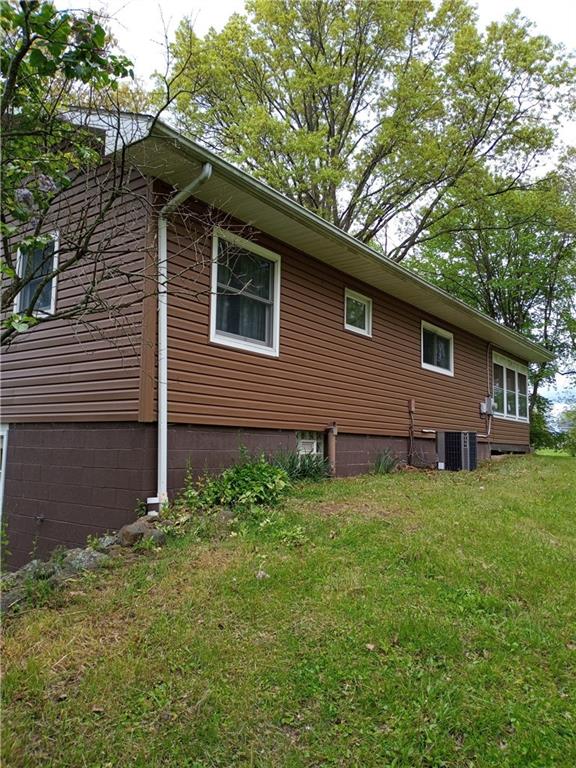 3292 Georgetown Road Polk, PA 16342 - Photo 3 of 24 a backyard of a house with lots of green space