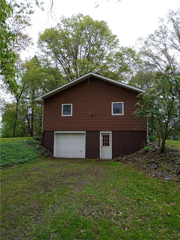 3292 Georgetown Road Polk, PA 16342 - Photo 4 of 24 a front view of a house with a garden