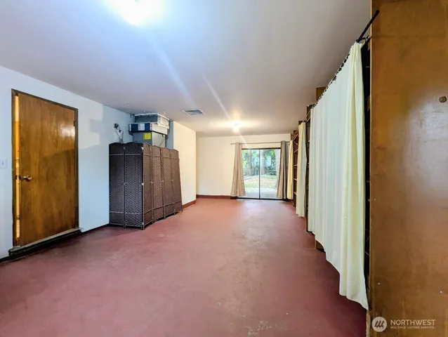 a view of a hallway with wooden shelves