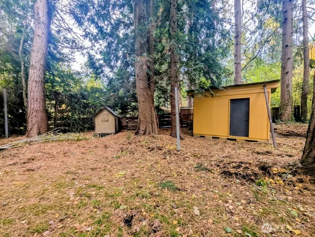 a front view of a building with a yard