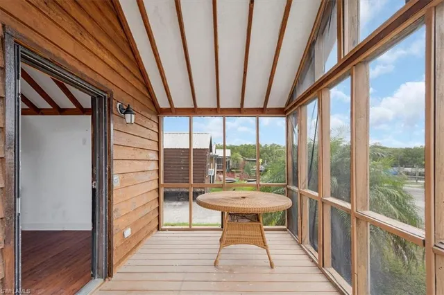 a view of a balcony with couch and wooden floor