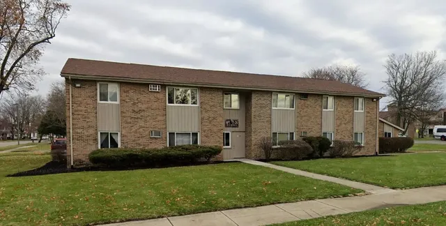 a view of house with yard