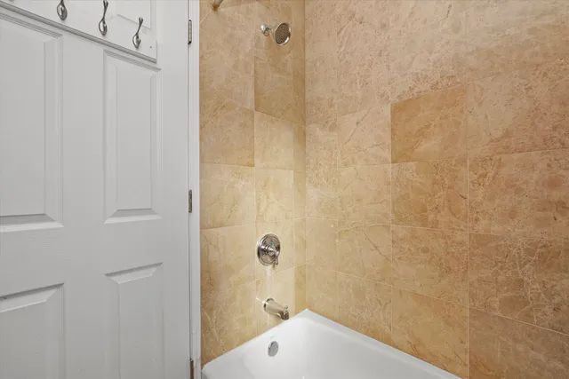 a bathroom with a sink and shower