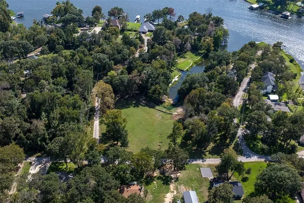 an aerial view of residential house with outdoor space and swimming pool