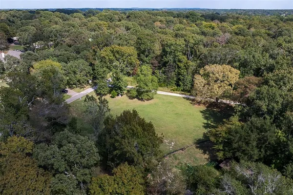 a view of a forest with a houses