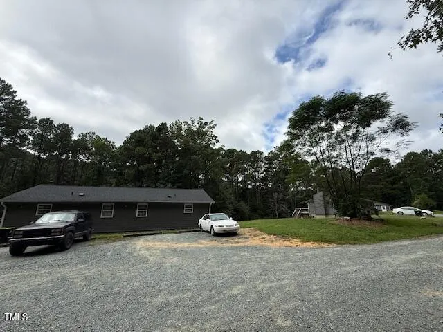 a house view with a garden space