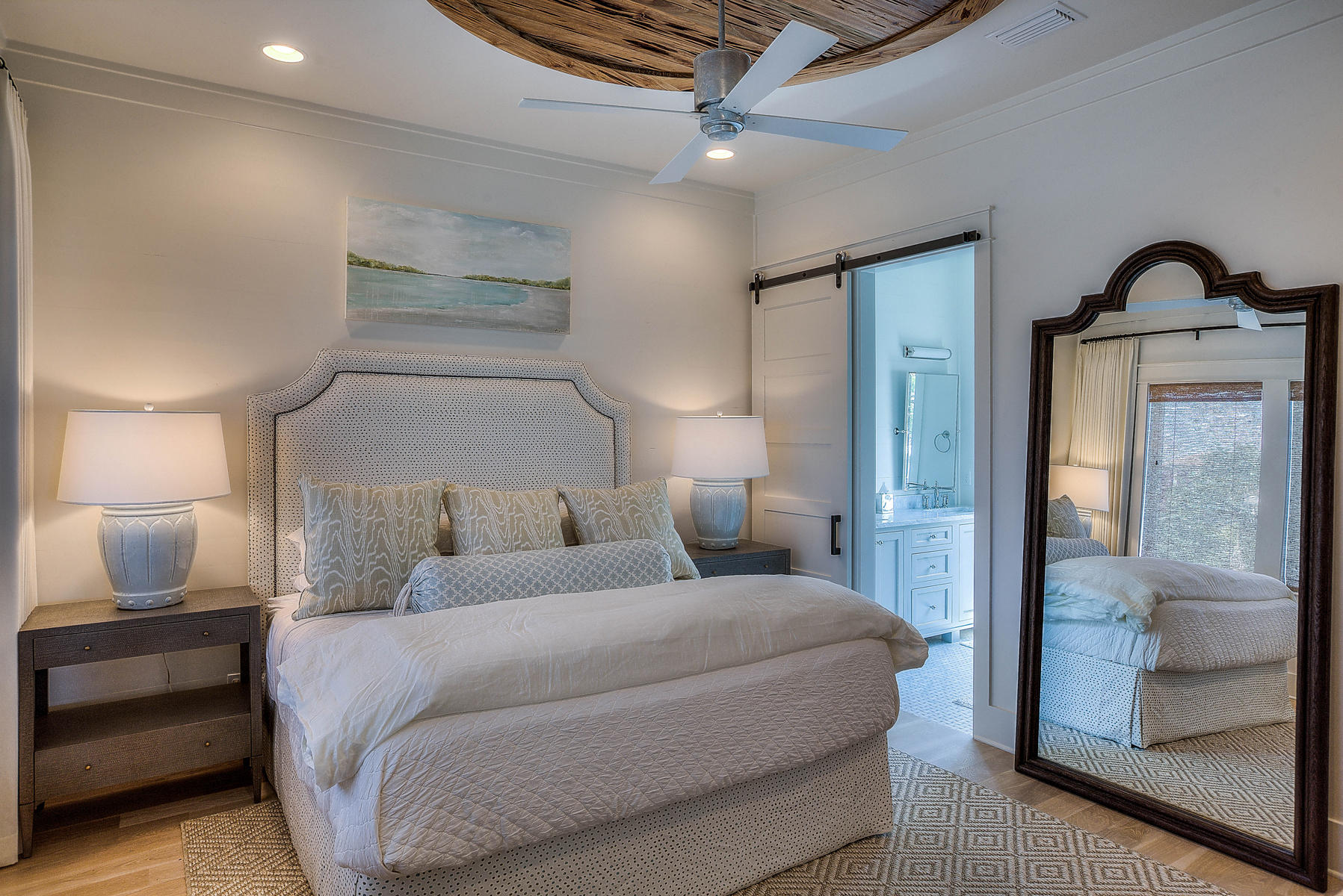 337 Blue Mountain Road Santa Rosa Beach, FL 32459 - Photo 14 of 31 a bedroom with a bed and a mirror