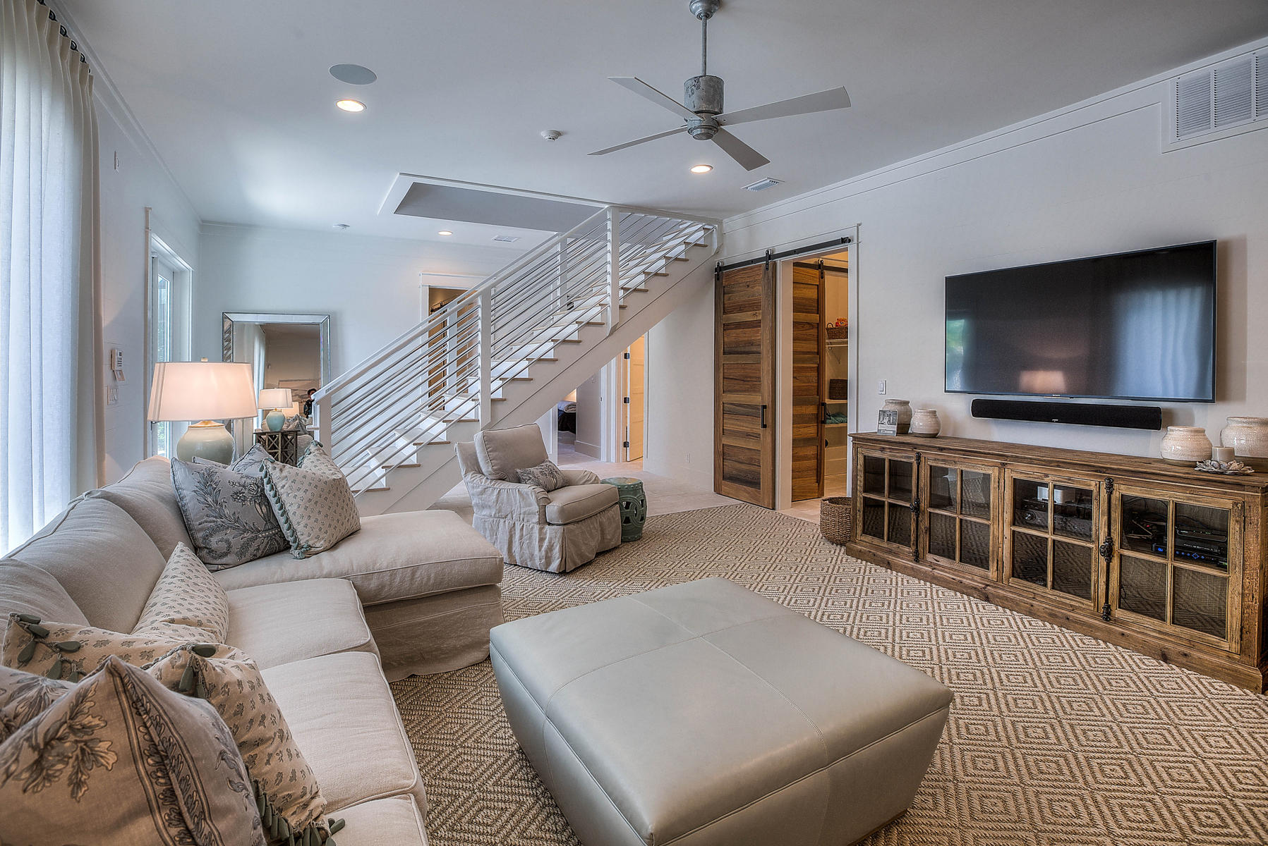 337 Blue Mountain Road Santa Rosa Beach, FL 32459 - Photo 18 of 31 a living room with furniture and a flat screen tv