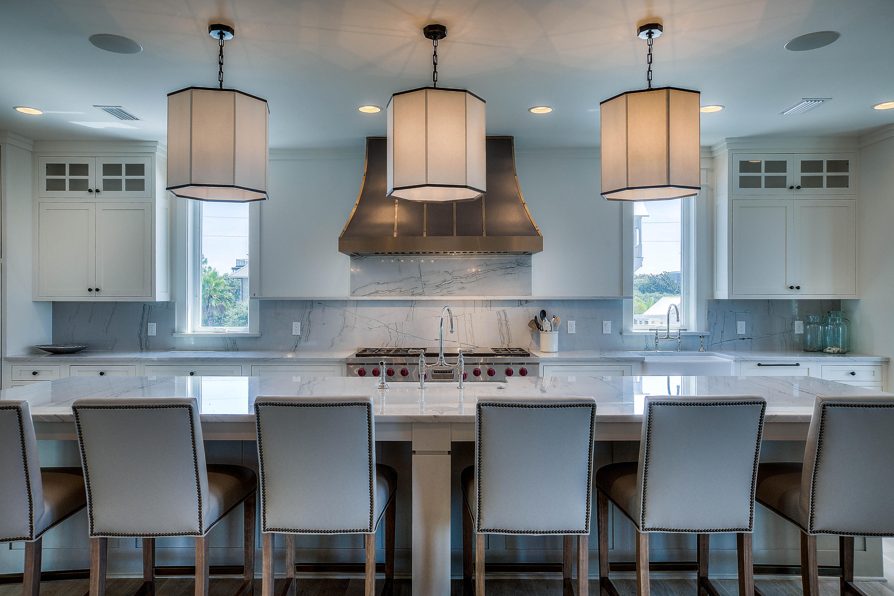 337 Blue Mountain Road Santa Rosa Beach, FL 32459 - Photo 2 of 31 a kitchen with stainless steel appliances granite countertop a stove top oven a sink a dining table and chairs with wooden floor