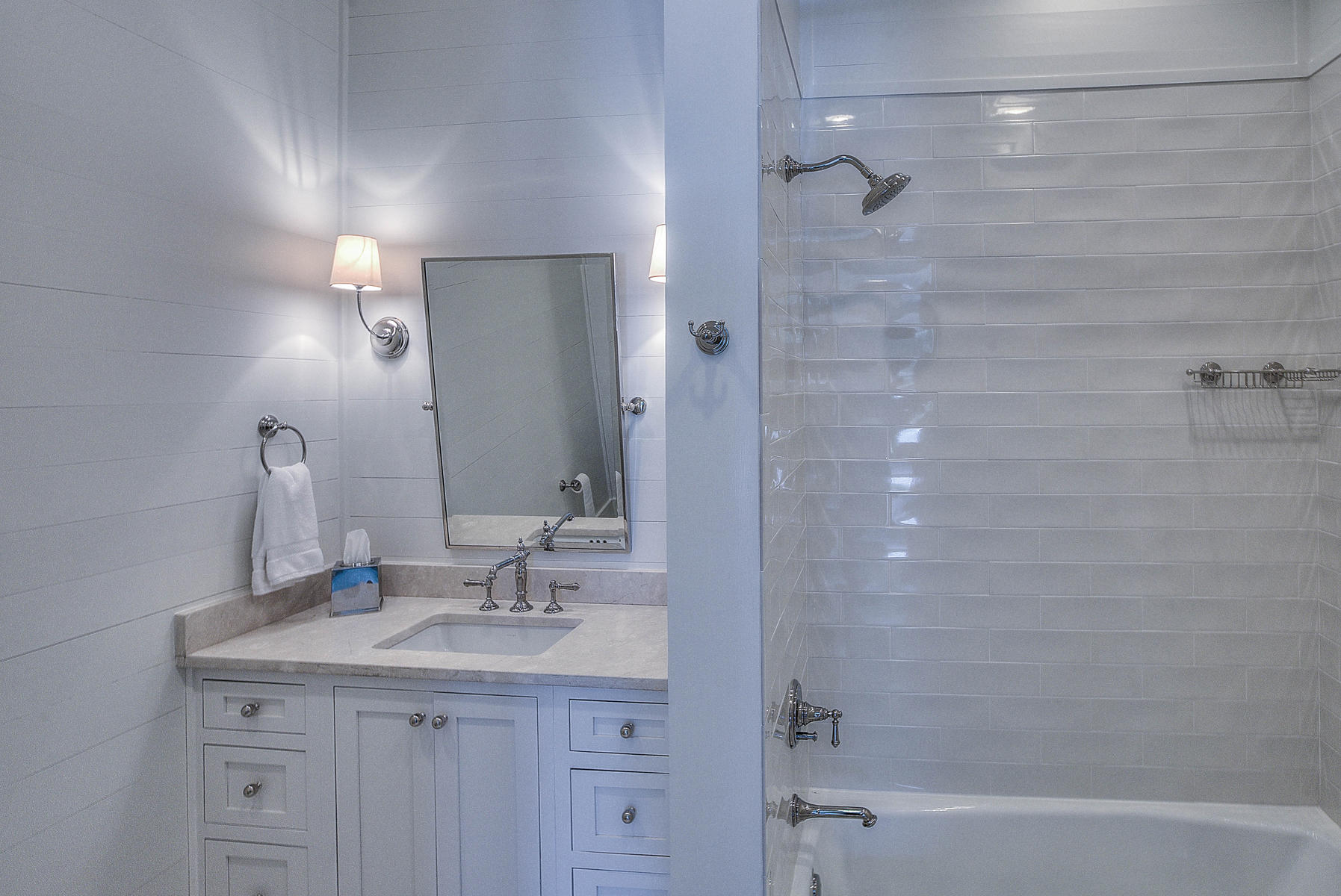 337 Blue Mountain Road Santa Rosa Beach, FL 32459 - Photo 22 of 31 a bathroom with a granite countertop sink a mirror and a bathtub