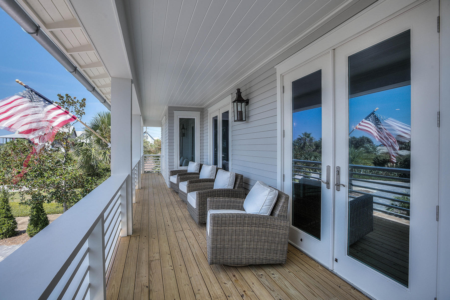 337 Blue Mountain Road Santa Rosa Beach, FL 32459 - Photo 26 of 31 a balcony with furniture and wooden floor