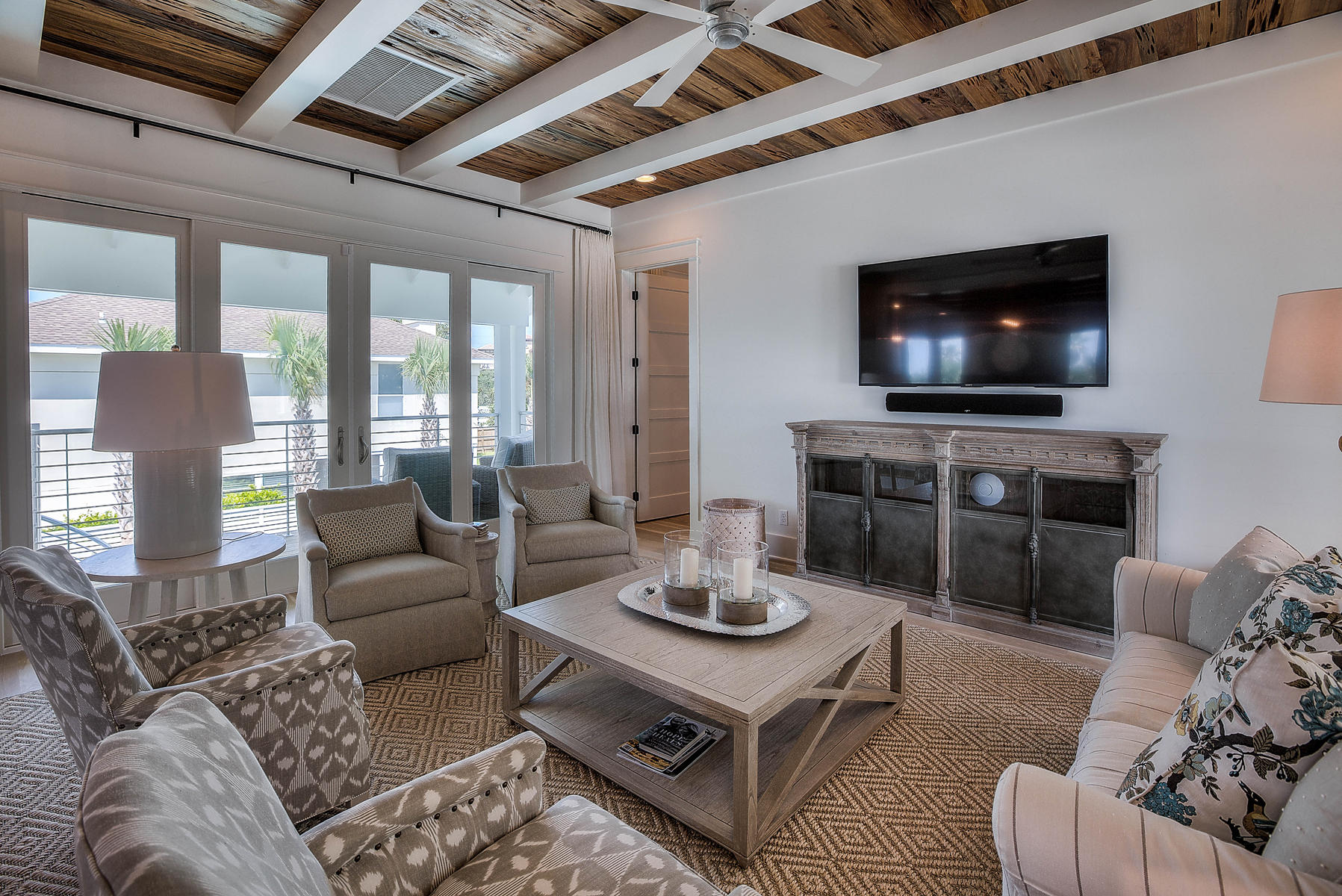 337 Blue Mountain Road Santa Rosa Beach, FL 32459 - Photo 7 of 31 a living room with furniture and a flat screen tv